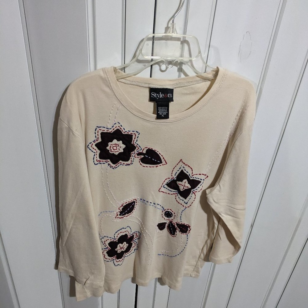 Beige blouse/with flower stitch.